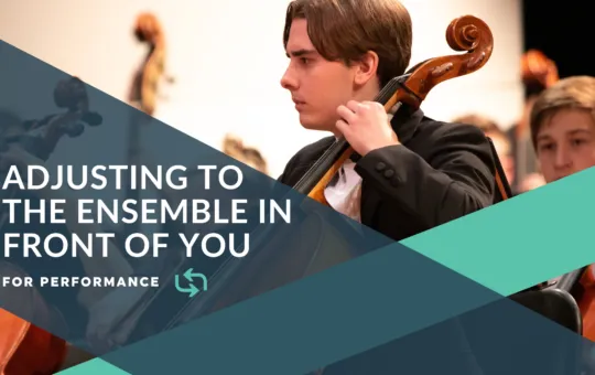 Orchestra student playing a bass cello in a holiday performance concert.